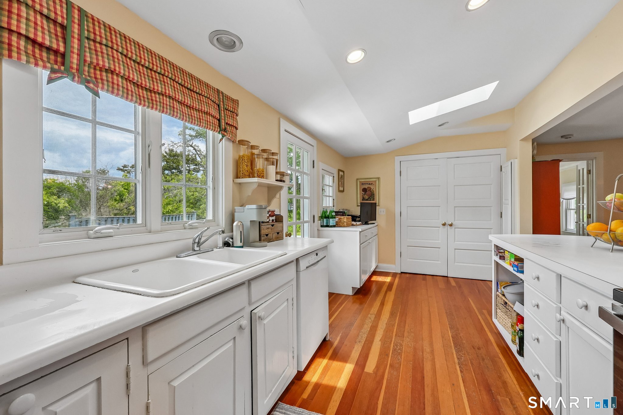 153 Middle Beach Road Madison, CT 06443 - Photo 12 of 25 The laundry is behind the double doors just off of the kitchen