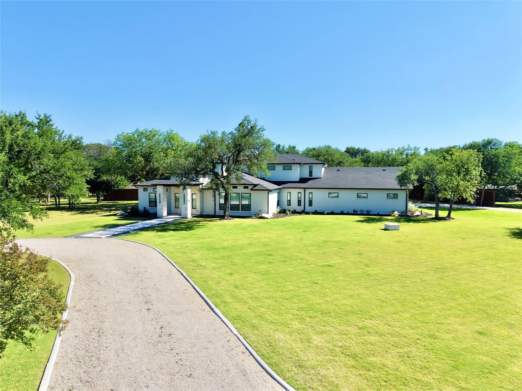 428 Squaw Creek Road Willow Park, TX 76087 - Photo 3 of 34 a view of a swimming pool with an outdoor seating and a yard