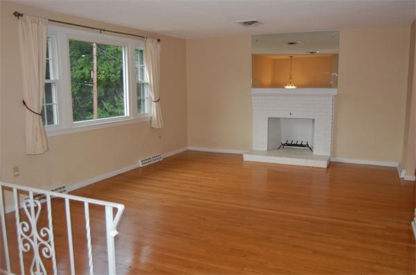 11 Short Street Canton, MA 02021 - Photo 3 of 30 a view of an empty room with a window and wooden floor