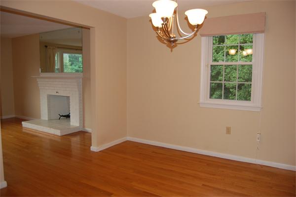 11 Short Street Canton, MA 02021 - Photo 5 of 30 an empty room with wooden floor cabinet and windows