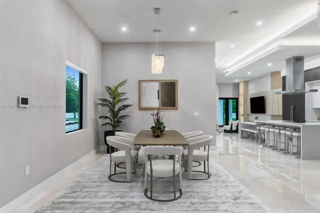 a dining room with furniture and wooden floor