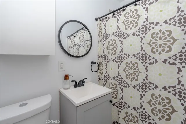 a bathroom with a toilet and a sink