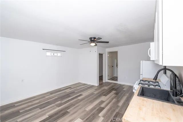 a bedroom with a bed and a stove