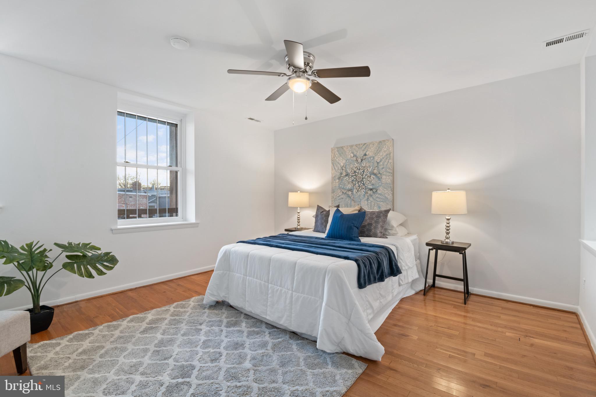 36 Q Street Northwest Washington, DC 20001 - Photo 11 of 40 a bedroom with a bed and a potted plant