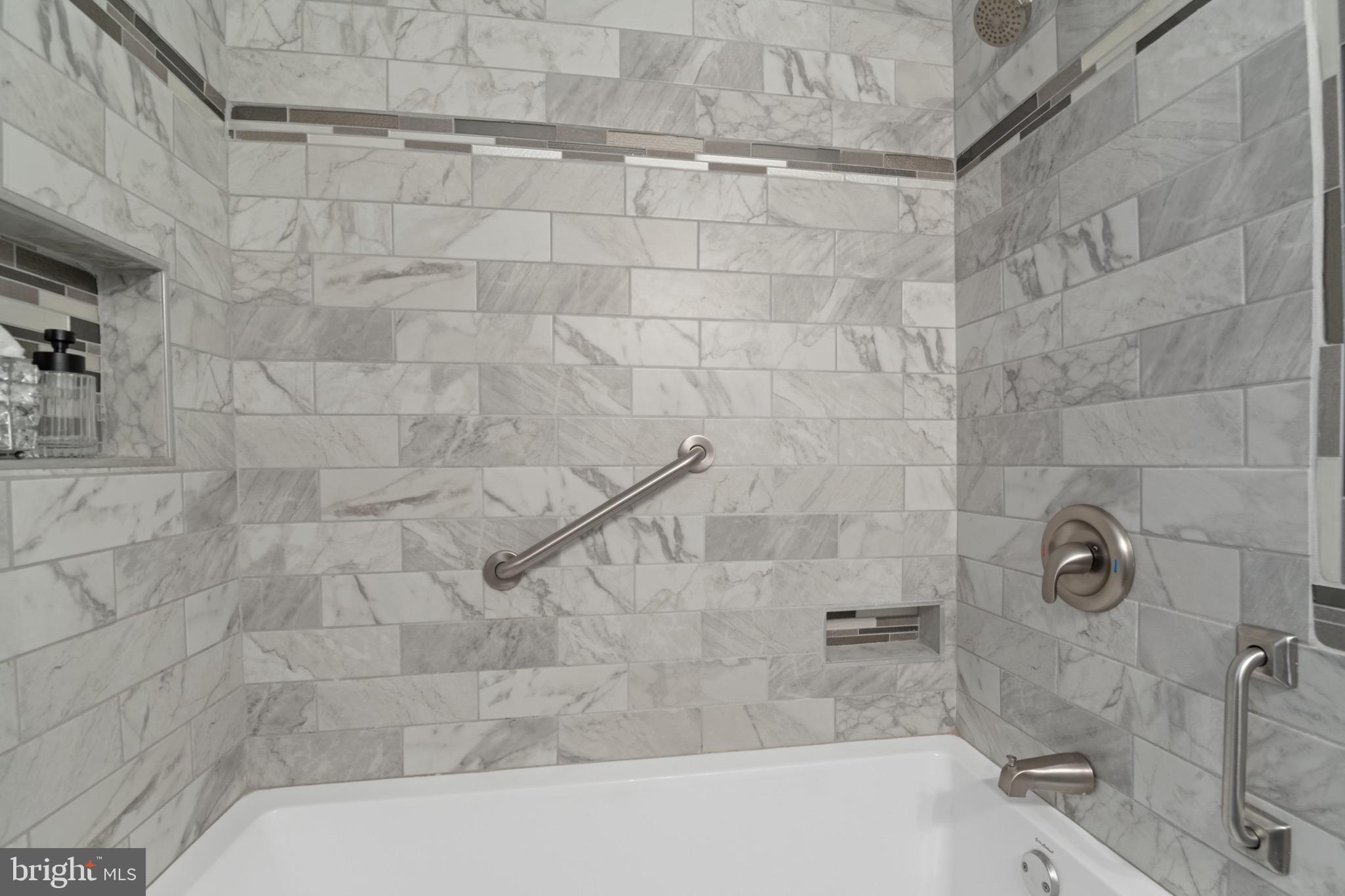 36 Q Street Northwest Washington, DC 20001 - Photo 18 of 40 a bathroom with a bathtub