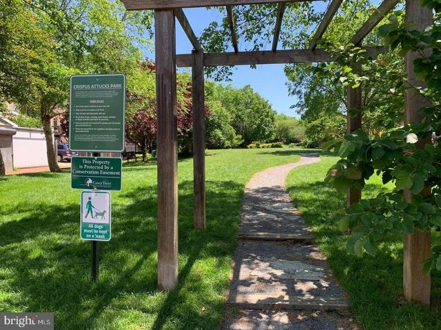 a view of people sitting in front of shop
