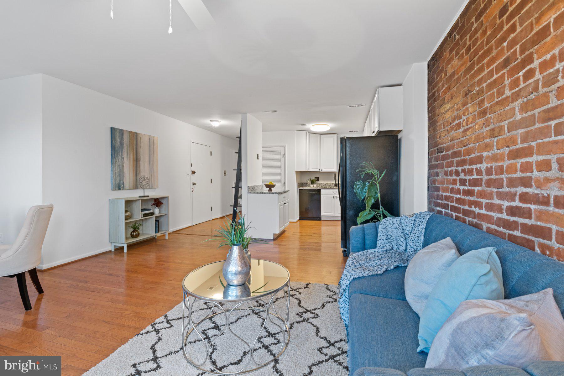 36 Q Street Northwest Washington, DC 20001 - Photo 6 of 40 a living room with furniture and kitchen view