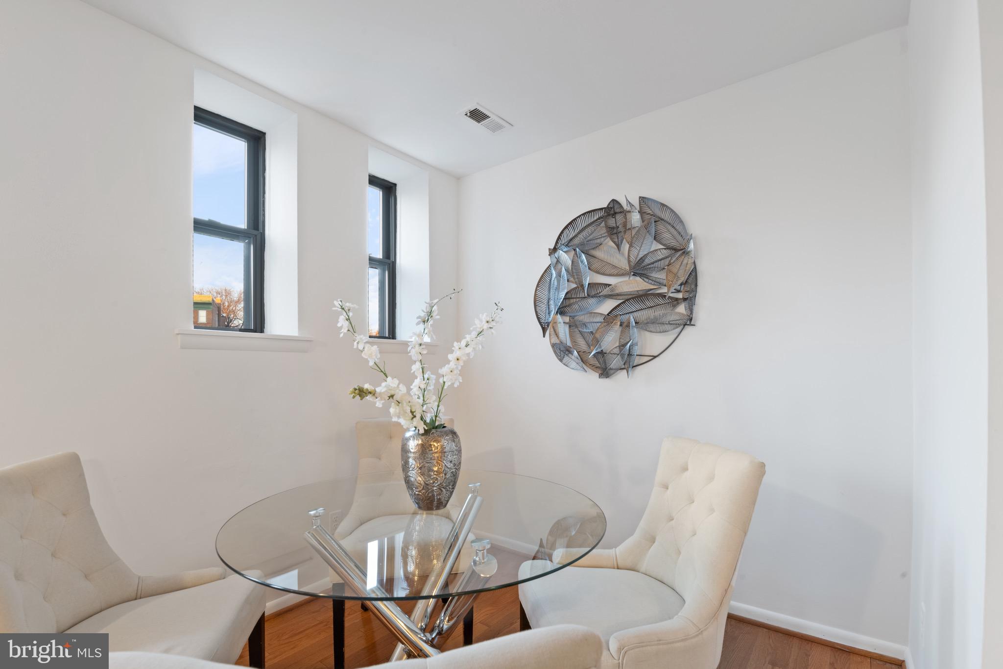 36 Q Street Northwest Washington, DC 20001 - Photo 9 of 40 a view of a dining room with furniture and chandelier