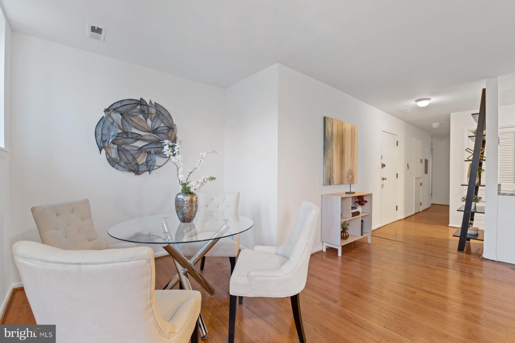 36 Q Street Northwest Washington, DC 20001 - Photo 10 of 40 a dining room with furniture and wooden floor