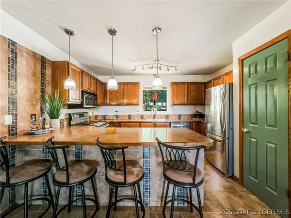 $215,000 | 28 Eleven W Court, Unit 2B, Sunrise Beach, MO 65079