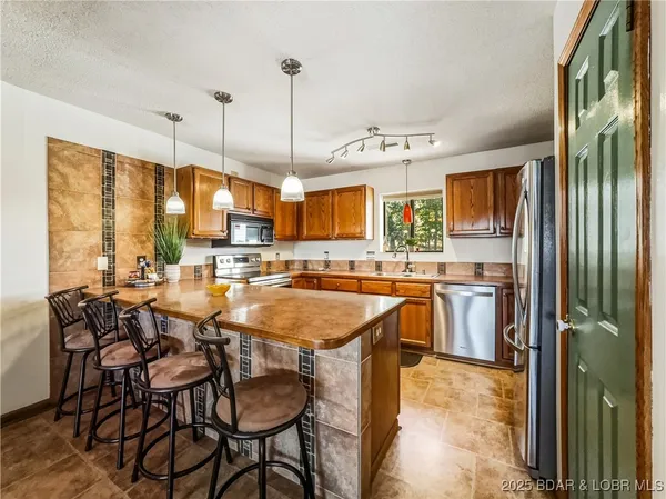 $215,000 | 28 Eleven W Court, Unit 2B, Sunrise Beach, MO 65079