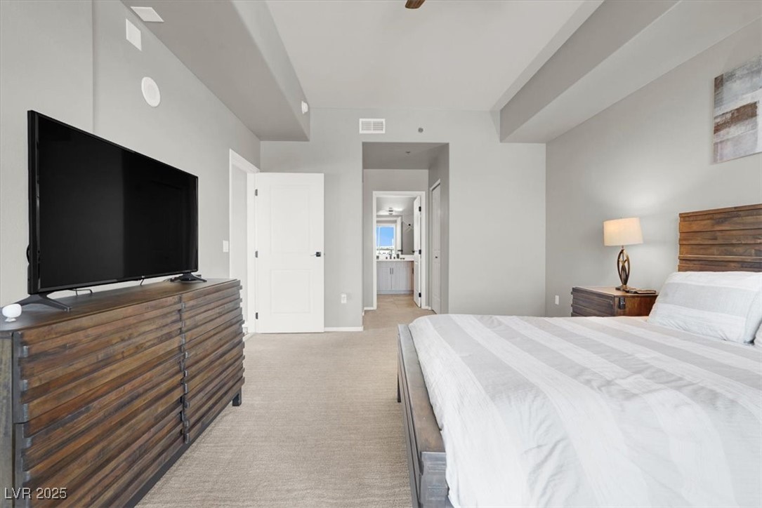 8255 South Las Vegas Boulevard, Unit 722 Las Vegas, NV 89123 - Photo 15 of 40 Bedroom featuring carpet floors and ensuite bath