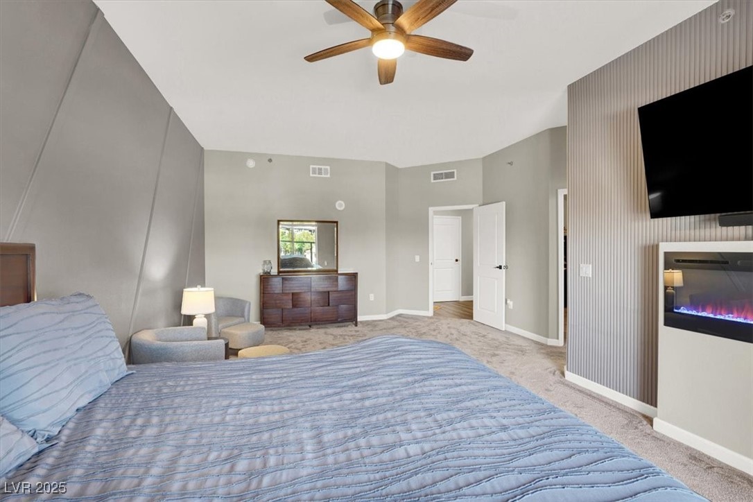 8255 South Las Vegas Boulevard, Unit 722 Las Vegas, NV 89123 - Photo 28 of 40 Bedroom with carpet floors and a ceiling fan
