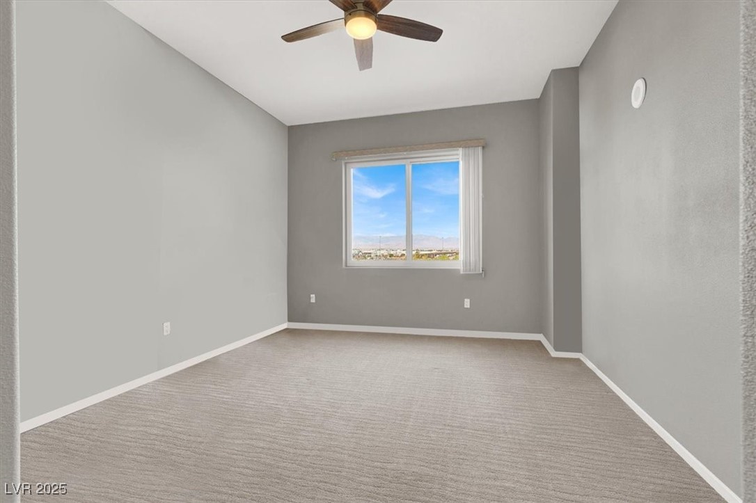 8255 South Las Vegas Boulevard, Unit 722 Las Vegas, NV 89123 - Photo 33 of 40 Spare room with a ceiling fan and carpet