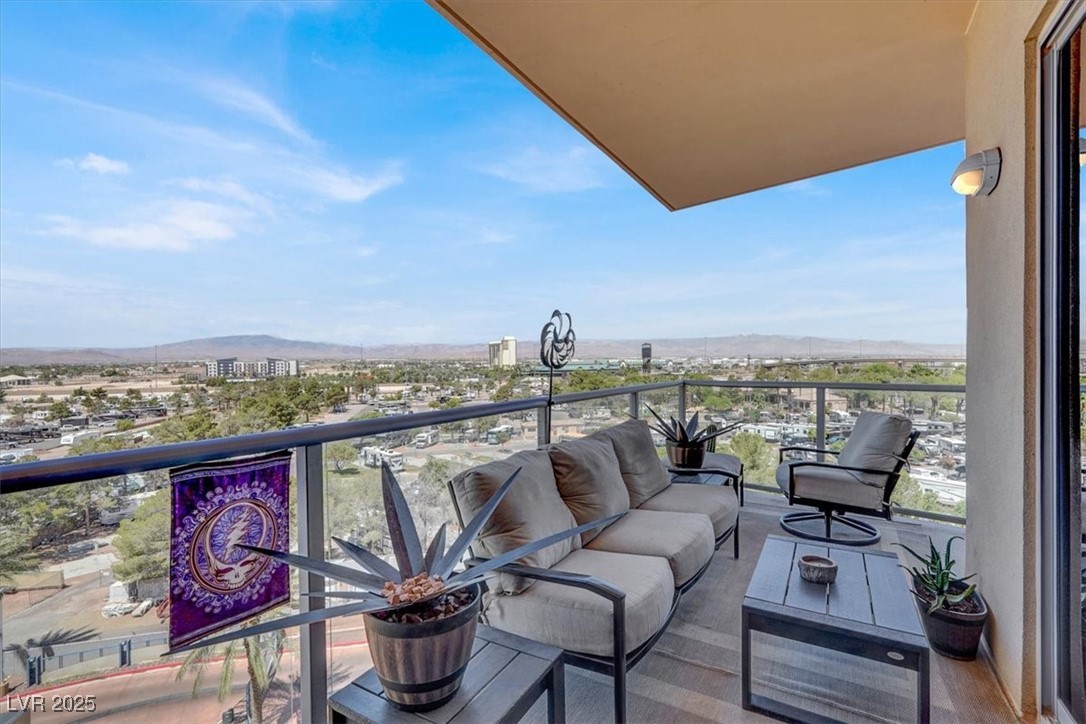 8255 South Las Vegas Boulevard, Unit 722 Las Vegas, NV 89123 - Photo 5 of 40 Balcony with a mountain view and an outdoor hangout area