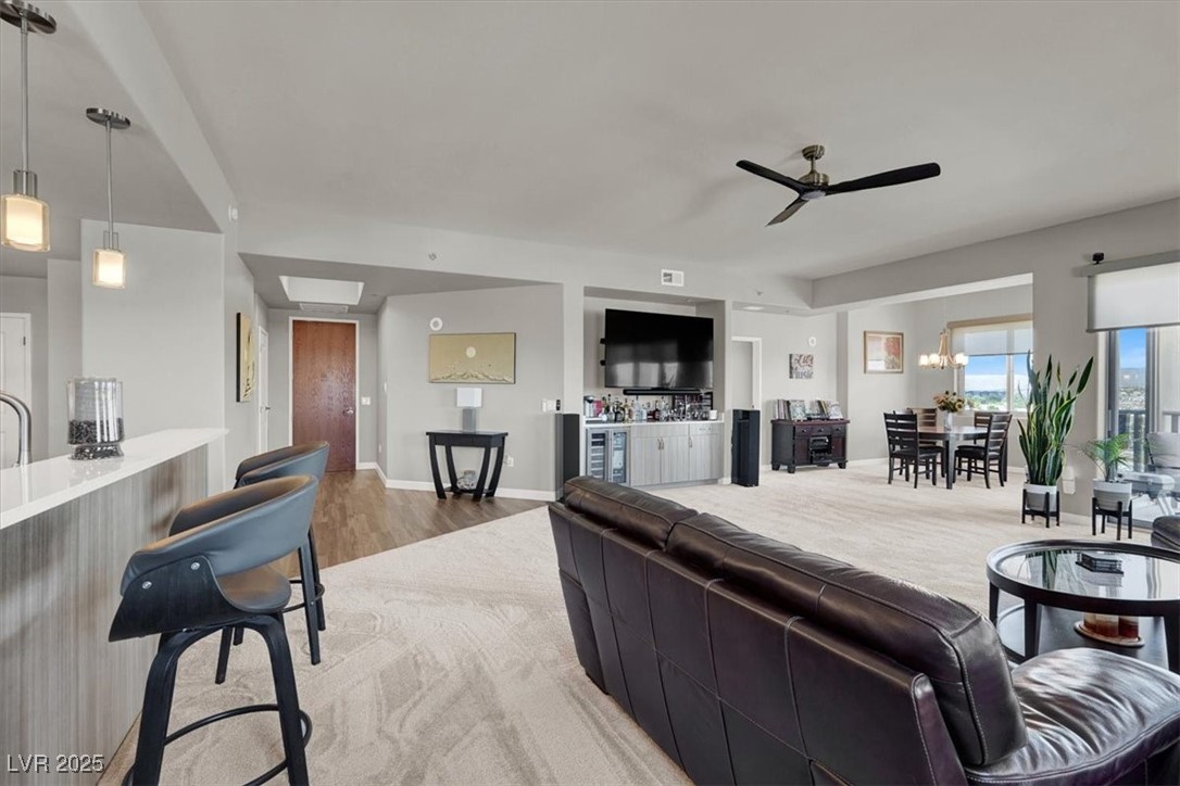 8255 South Las Vegas Boulevard, Unit 722 Las Vegas, NV 89123 - Photo 6 of 40 Living area with ceiling fan and light wood finished floors