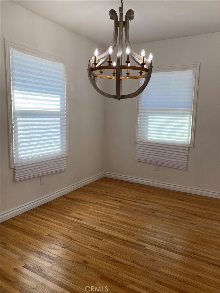 1125 North Verdugo Road Glendale, CA 91206 - Photo 2 of 7 a view of a room with wooden floor chandelier and windows