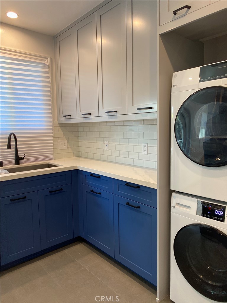 1125 North Verdugo Road Glendale, CA 91206 - Photo 3 of 7 a kitchen that has a sink and a stove with wooden floor