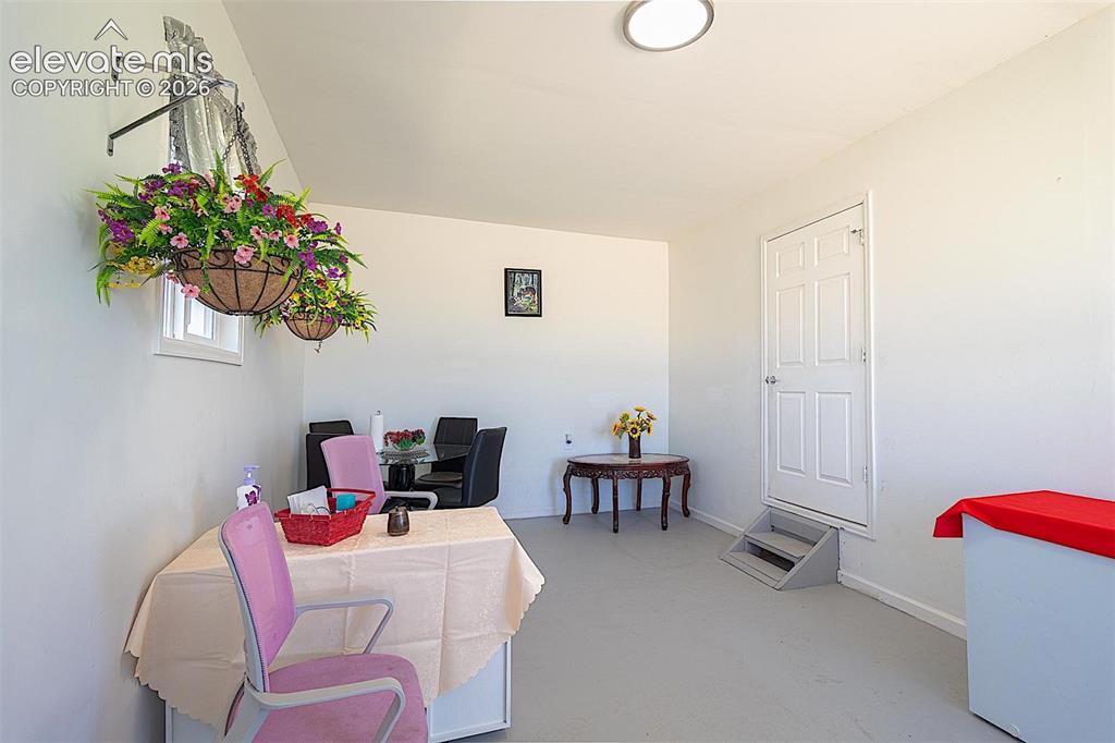 3425-3435 Wiesner Road Calhan, CO 80808 - Photo 18 of 25 Home office with concrete flooring and baseboards