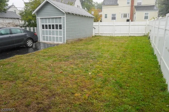 a view of backyard with a garden and deck