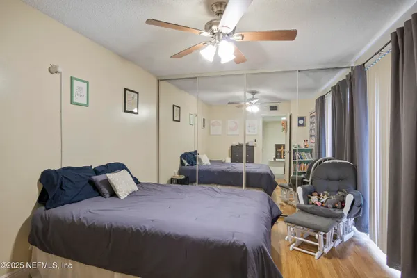 a bedroom with a bed and furniture