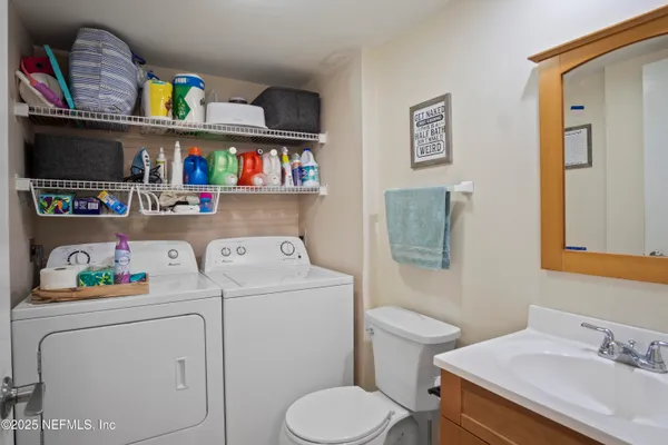 a bathroom with a sink a vanity and a toilet