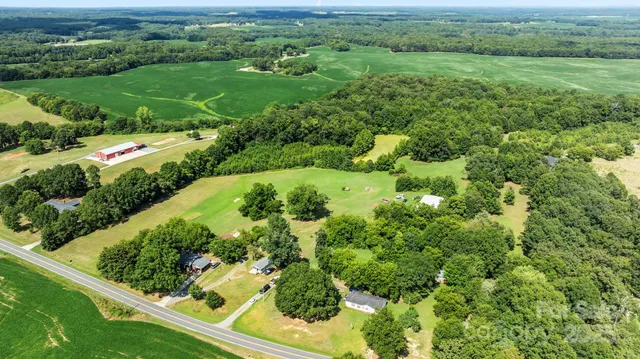 a view of a garden with a building in the background