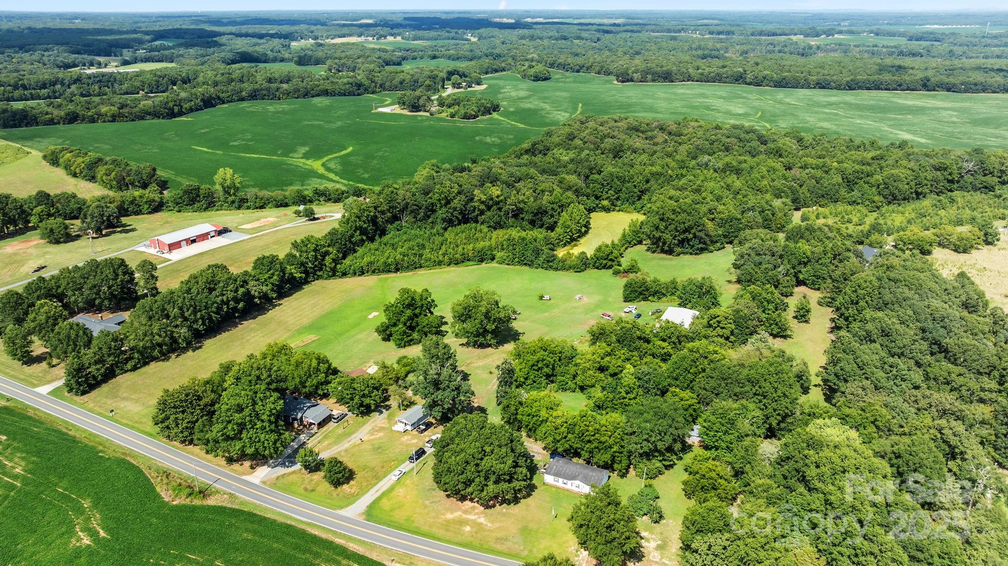 a view of a garden with a building in the background