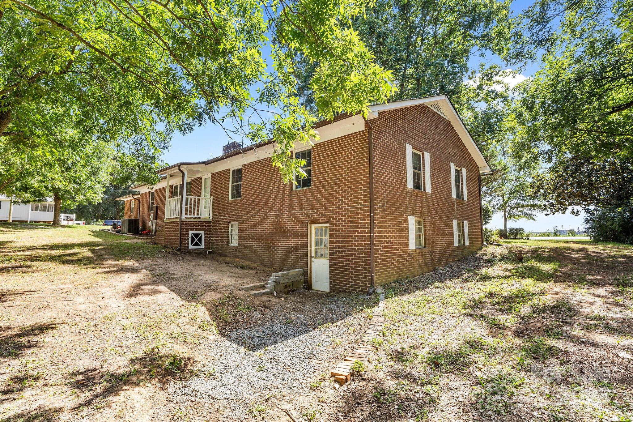 3825 Stack Road Monroe, NC 28112 - Photo 13 of 20 a front view of a house with a yard and garage