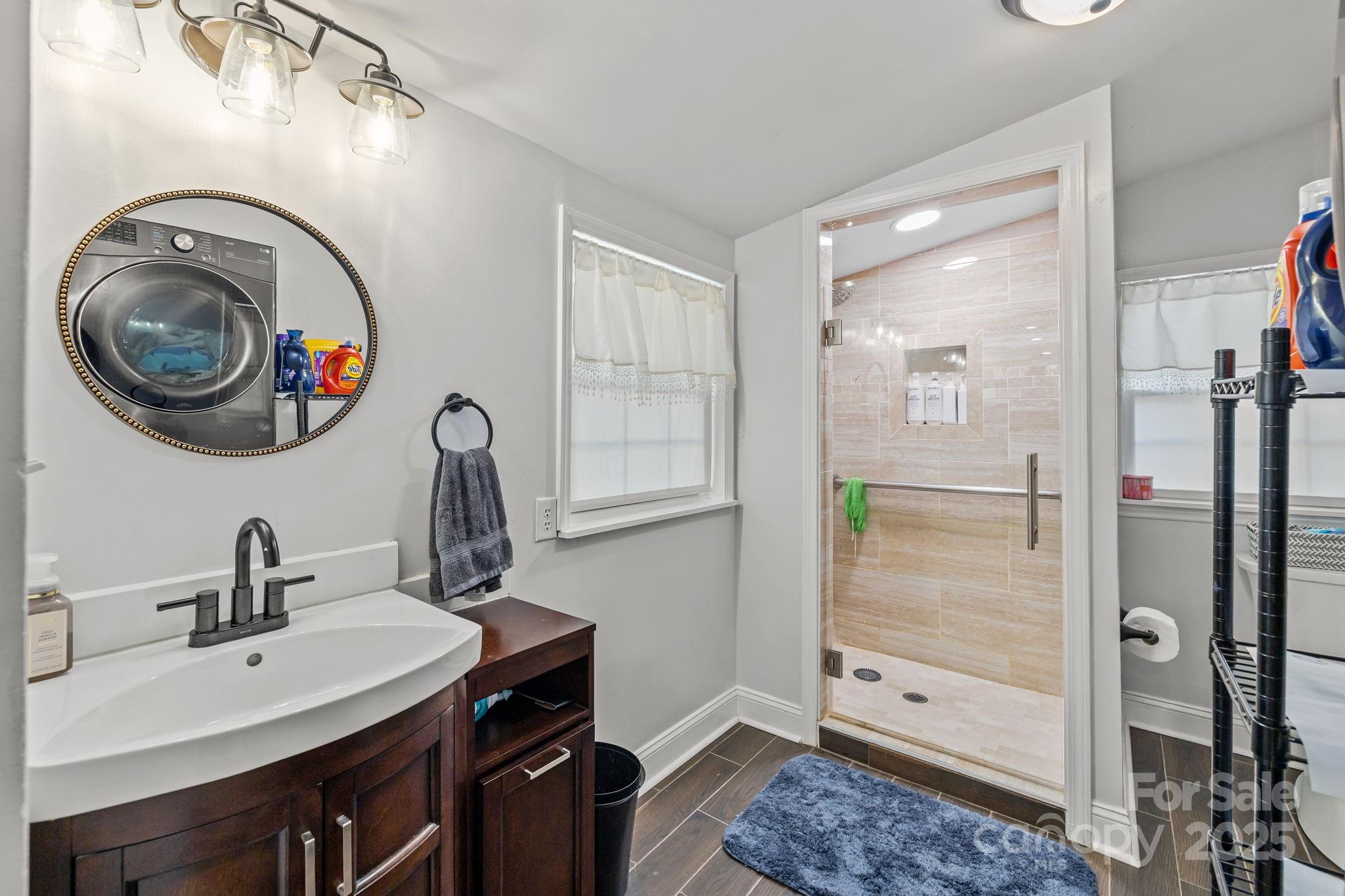 3825 Stack Road Monroe, NC 28112 - Photo 19 of 20 a bathroom with a sink a toilet and shower