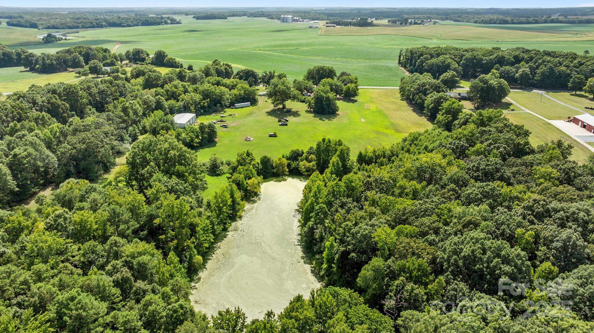 3825 Stack Road Monroe, NC 28112 - Photo 3 of 20 a view of a lake with a yard