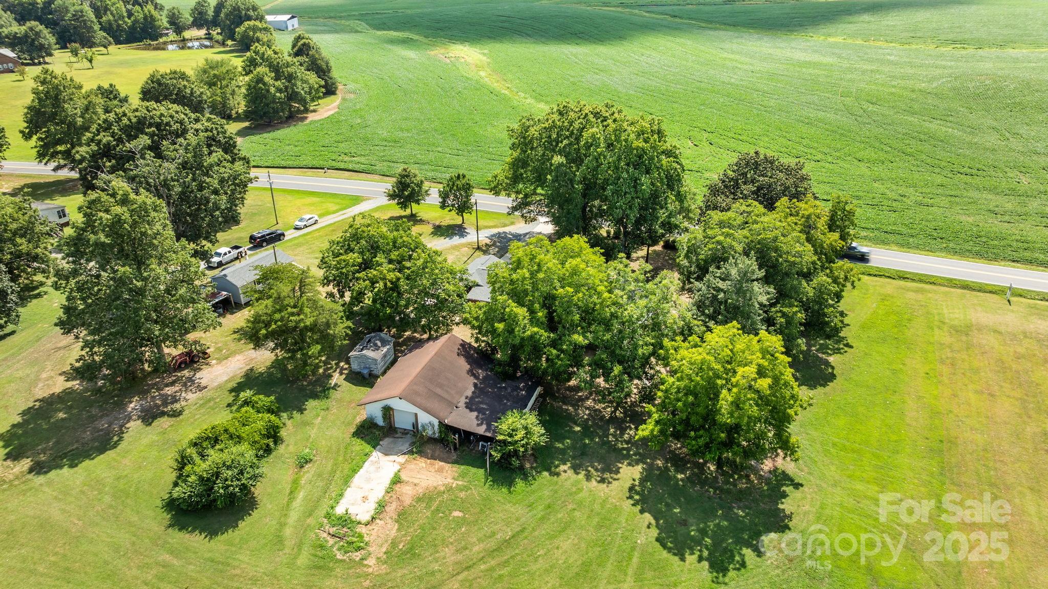 3825 Stack Road Monroe, NC 28112 - Photo 4 of 20 a view of a lake with a houses