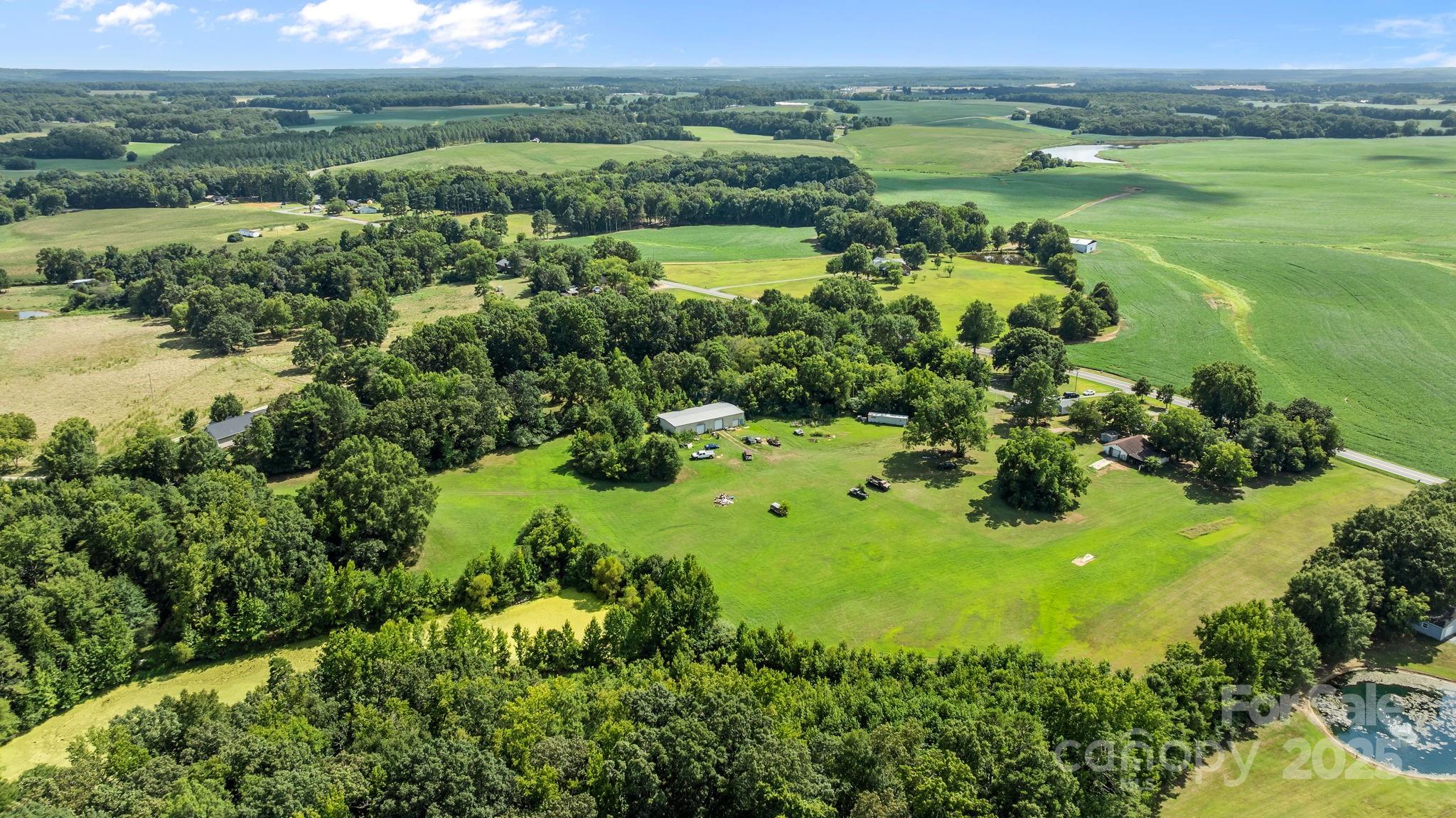 3825 Stack Road Monroe, NC 28112 - Photo 6 of 20 a view of a lake with a houses