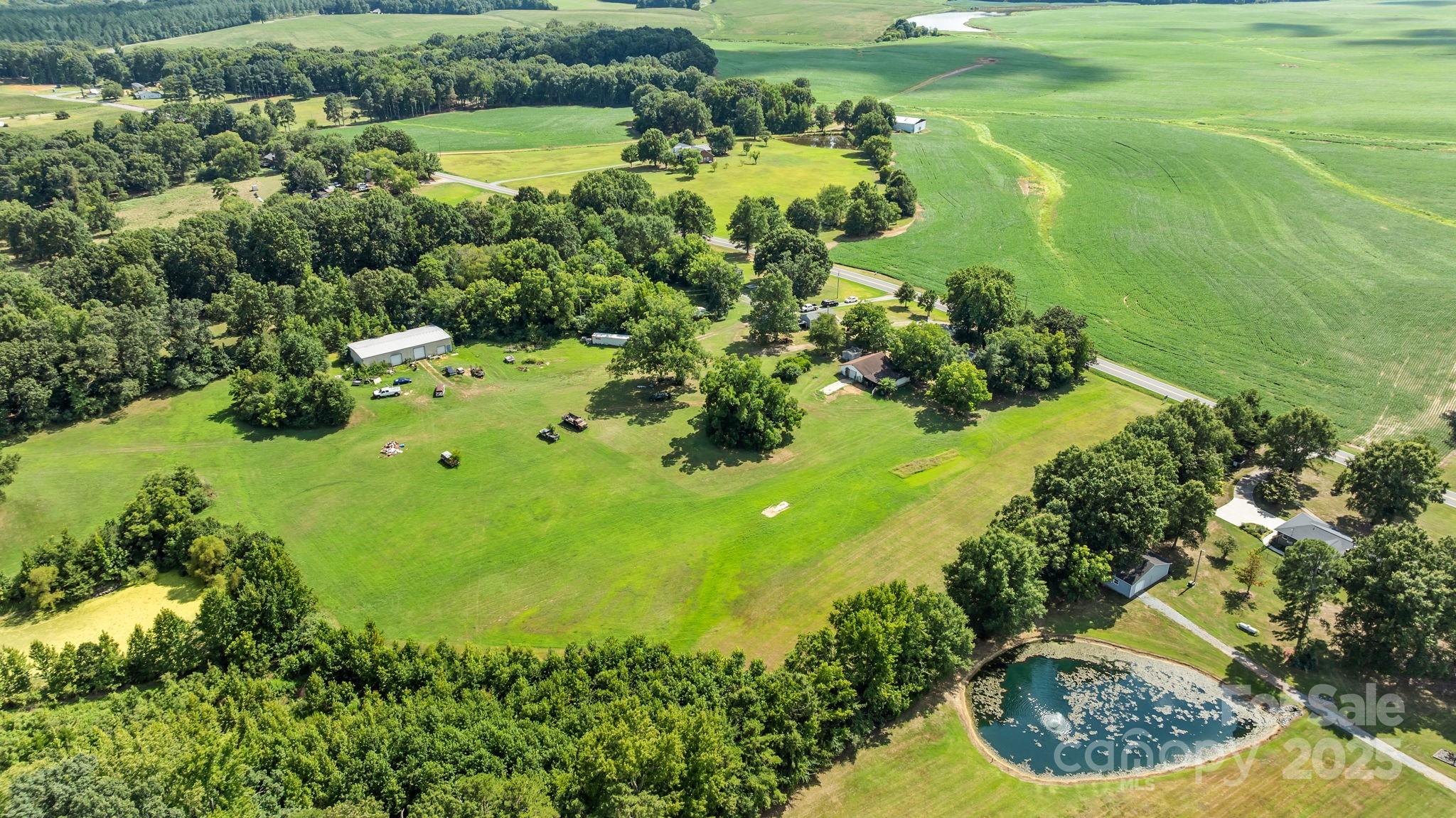 3825 Stack Road Monroe, NC 28112 - Photo 7 of 20 a view of a garden with a lake
