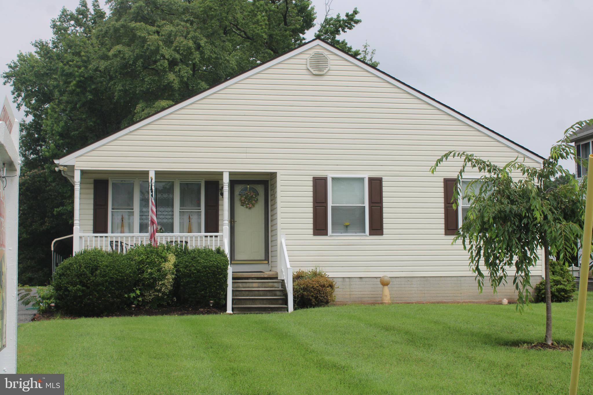 1604 Cape May Road Baltimore, MD 21221 - Photo 1 of 30 a view of a house with a yard and potted plants