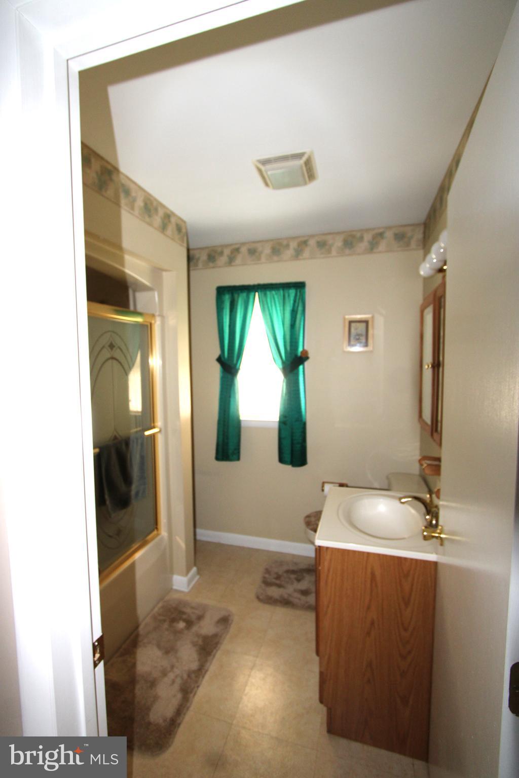 1604 Cape May Road Baltimore, MD 21221 - Photo 15 of 30 a living room with furniture and a large window