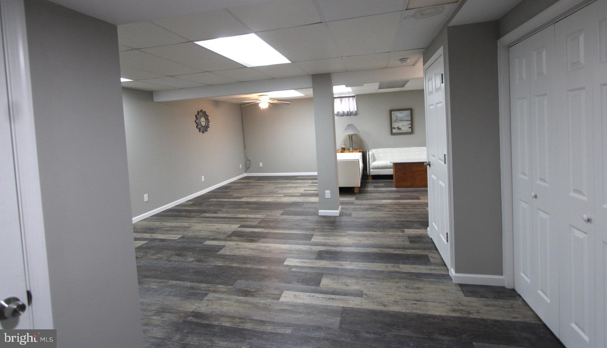 1604 Cape May Road Baltimore, MD 21221 - Photo 20 of 30 a view of empty room with wooden floor