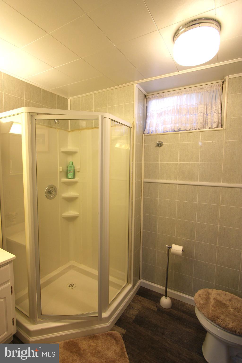 1604 Cape May Road Baltimore, MD 21221 - Photo 21 of 30 a bathroom with a shower and a toilet