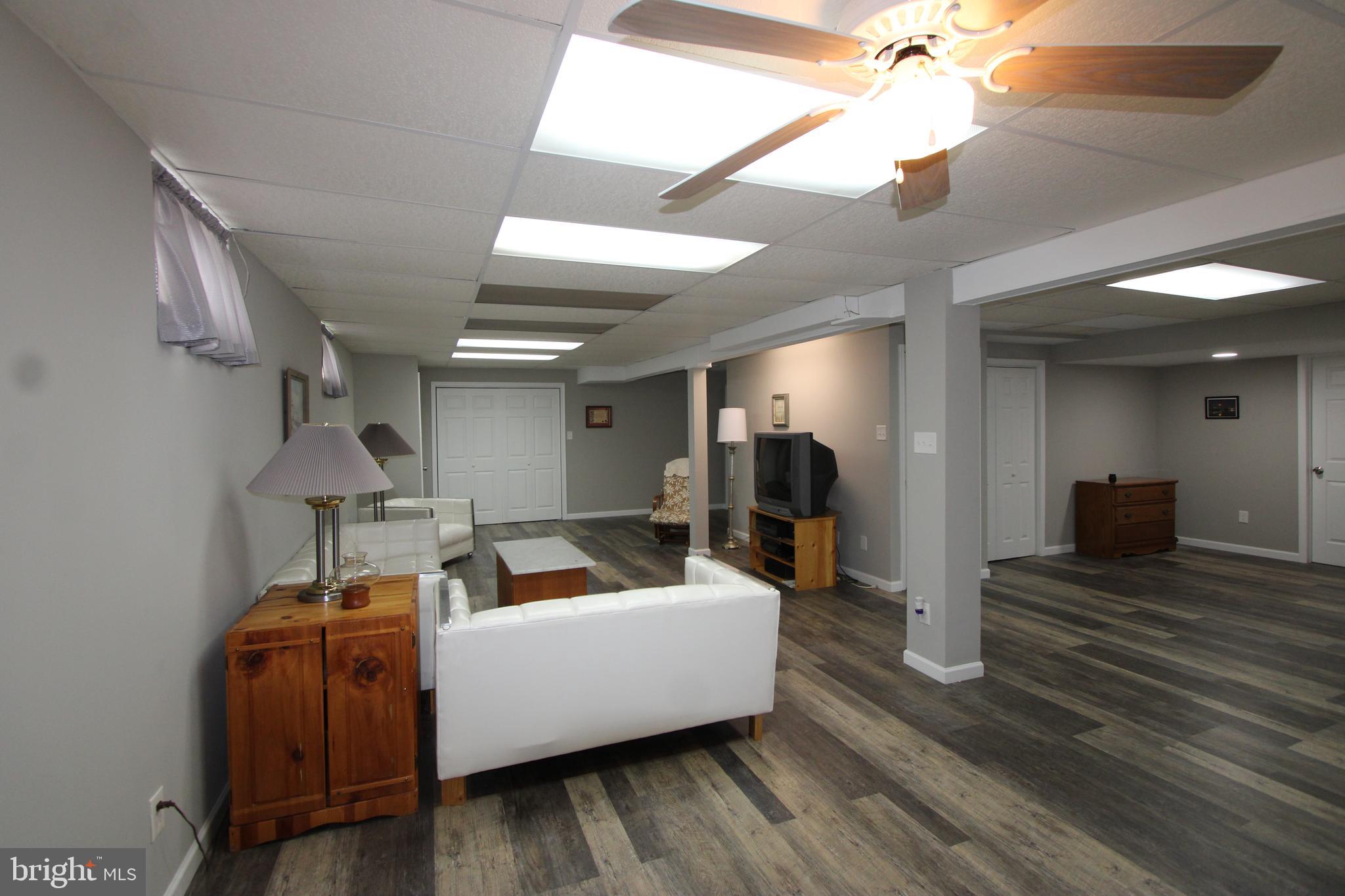1604 Cape May Road Baltimore, MD 21221 - Photo 25 of 30 a living room with furniture and a wooden floor