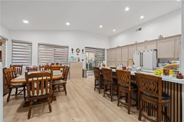 a view of a dining area with furniture window and wooden floor
