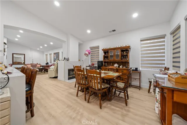 a view of a dining area with furniture window and wooden floor