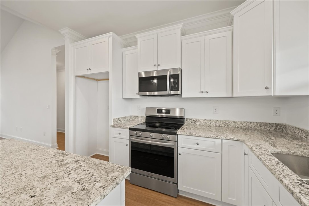 108 Oak Grove Road Norris, SC 29667 - Photo 13 of 35 This bright kitchen features ample counter space and modern appliances, perfect for any culinary enthusiast.