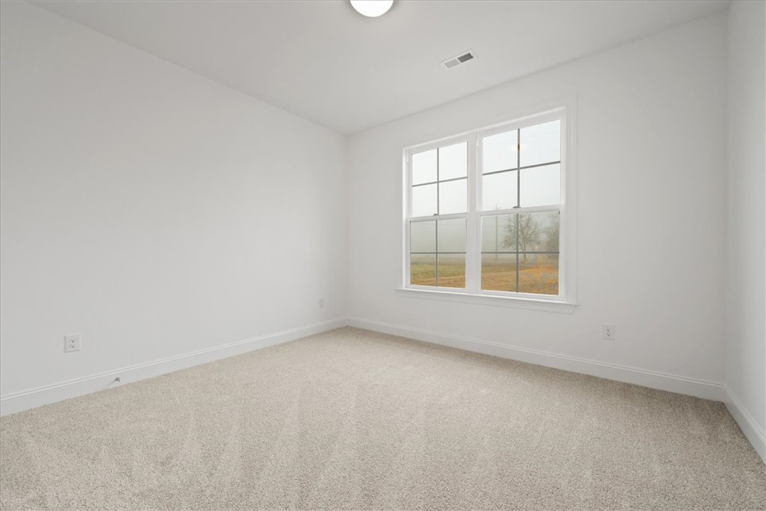 108 Oak Grove Road Norris, SC 29667 - Photo 18 of 35 This bright and airy room features soft carpeting, providing a comfortable and inviting atmosphere.