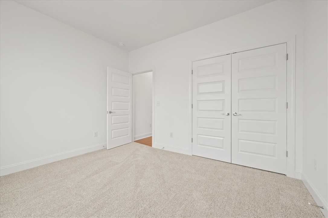 108 Oak Grove Road Norris, SC 29667 - Photo 19 of 35 This bright room features soft carpeting and ample closet space, ready for personalization.