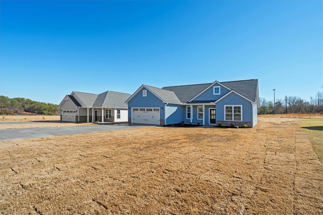 108 Oak Grove Road Norris, SC 29667 - Photo 2 of 35 This newly constructed residence showcases a charming facade with modern architectural details.