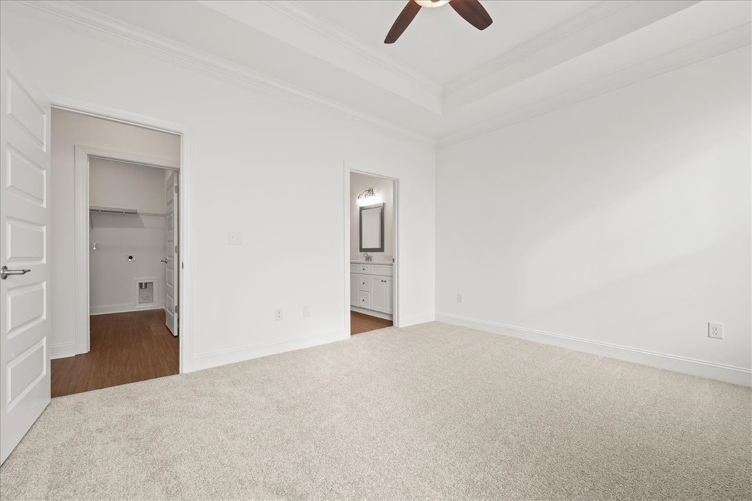 108 Oak Grove Road Norris, SC 29667 - Photo 23 of 35 This spacious bedroom offers comfortable carpeting and convenient access to the primary bathroom and walk-in closet.