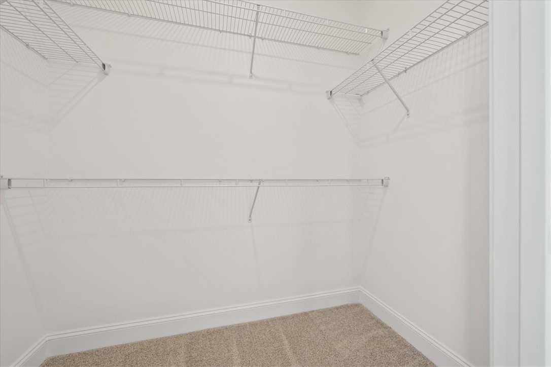 108 Oak Grove Road Norris, SC 29667 - Photo 27 of 35 This spacious walk-in closet offers ample storage with practical wire shelving.
