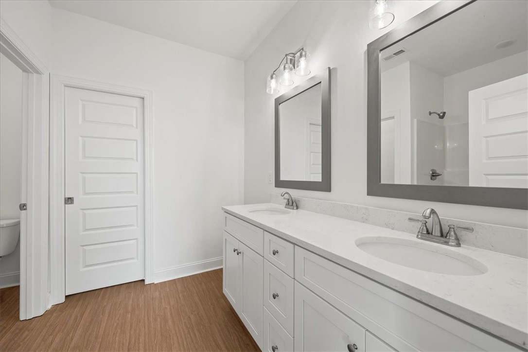 108 Oak Grove Road Norris, SC 29667 - Photo 28 of 35 This primary bathroom offers dual sinks with elegant countertops and ample vanity storage.