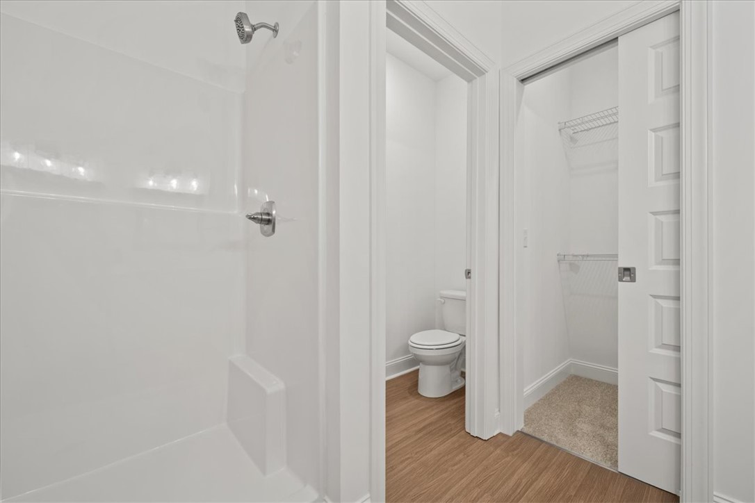 108 Oak Grove Road Norris, SC 29667 - Photo 29 of 35 This bathroom features a shower, toilet, and an adjacent closet with convenient storage.
