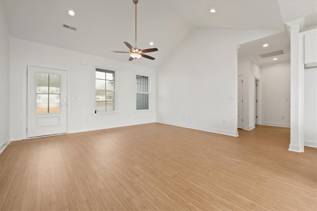 108 Oak Grove Road Norris, SC 29667 - Photo 6 of 35 This living room features vaulted ceilings and light wood flooring, offering a bright and spacious atmosphere.